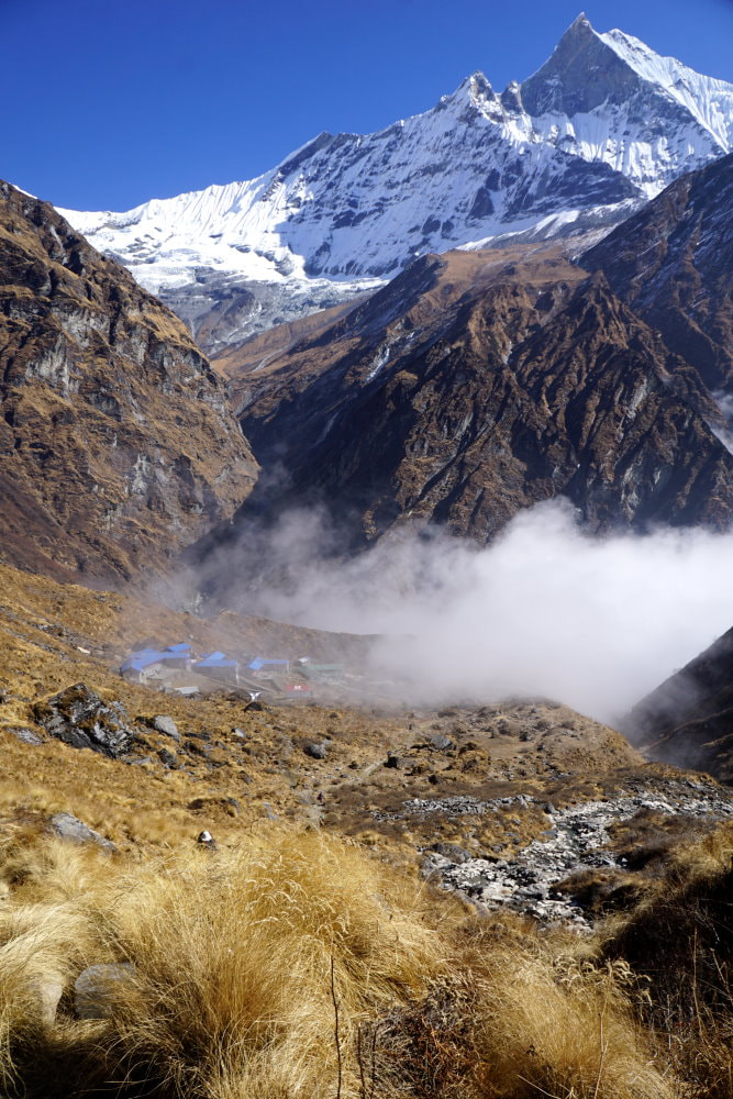 Machhapuchhre Base Camp being swallowed by the fog - ABC Trek Day 4